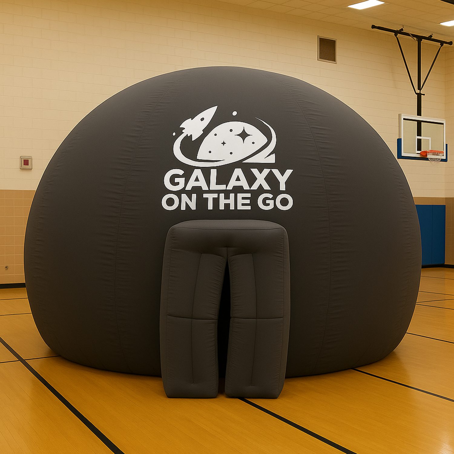 Galaxy on the Go planetarium dome set up in a school gymnasium.