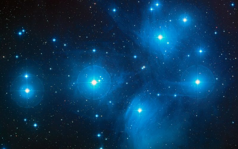 The Pleiades star cluster and its surrounding blue nebulosity.